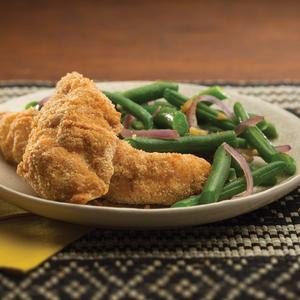 Photo of oven-fried chicken tenders and green beans on a plate
