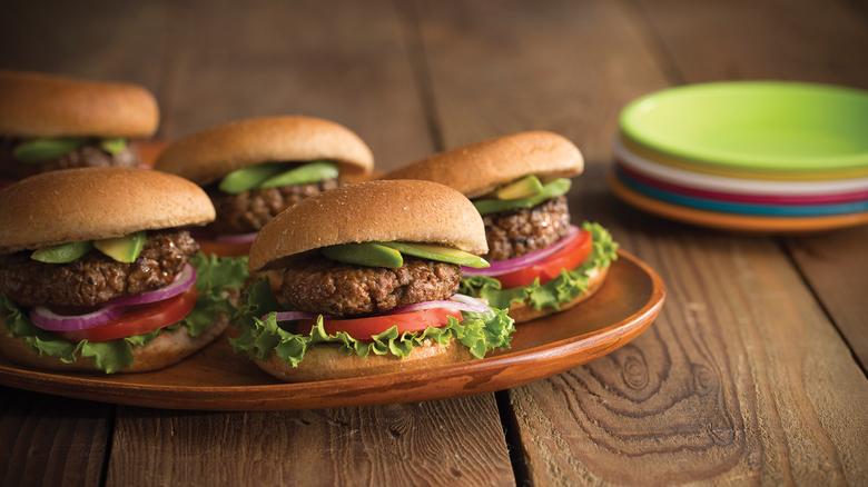 Photo of five mini burgers on a platter