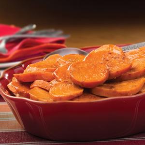 Photo of holiday sweet potatoes in a red baking dish