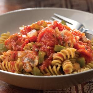 Photo of a bowl with pasta and garden sauce