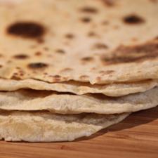 Photo of a stack of fresh tortillas