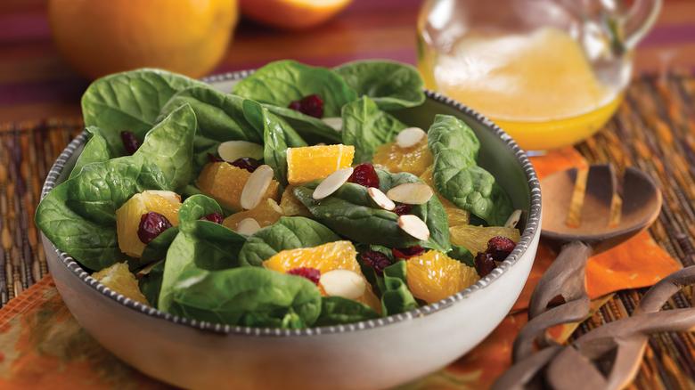 Photo of spinach and citrus salad in a bowl