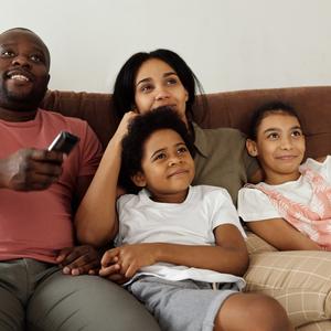 Photo of family watching tv
