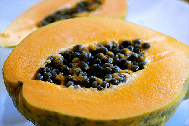 Photo of a papaya cut in half