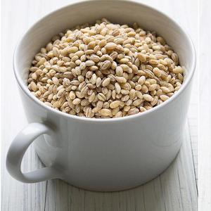 Photo of uncooked grains in a white mug