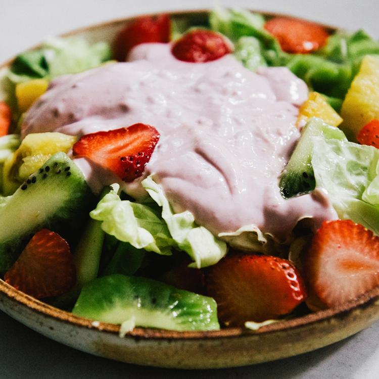 Fruit salad completed with lettuce, fruit and yogurt