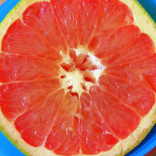 Photo of a citrus fruit cut in half
