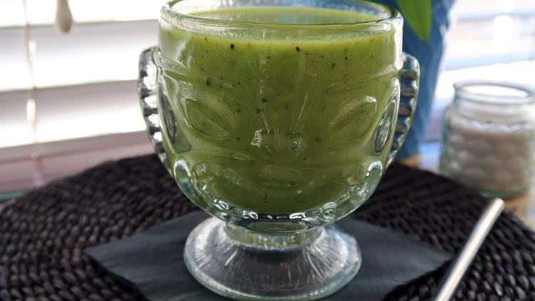 Photo of a glass of prepared green alligator smoothie