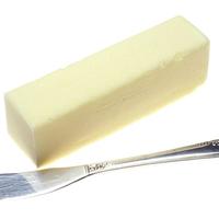 Photo of a stick of butter next to a butter knife