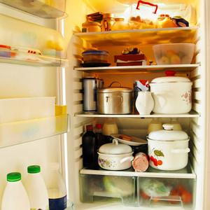 Photo of a refrigerator with many items on all of the shelves