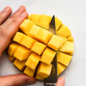 A photo showing the fifth step in cutting mango