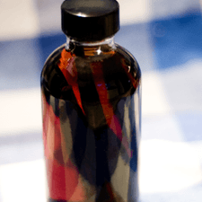 Photo of a glass jar with vanilla extract