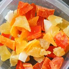 Photo of chopped up dried fruit in a plastic container