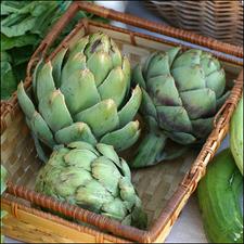 Photo of three artichokes in a basket