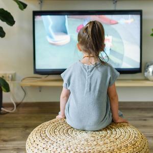 Photo of a child in front of a TV