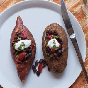 Photo of two Southwest Baked Potatoes on a plate