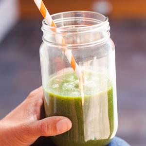 Photo of Green Smoothie in a glass jar, with a straw