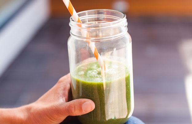 Photo of Green Smoothie in a glass jar, with a straw