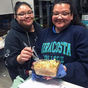 Photo of two girls cooking