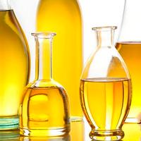 Photo of several glass jars of vegetable oil