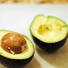 Photo of an avocado cut in half