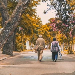 Photo of a couple walking on neighborhood street