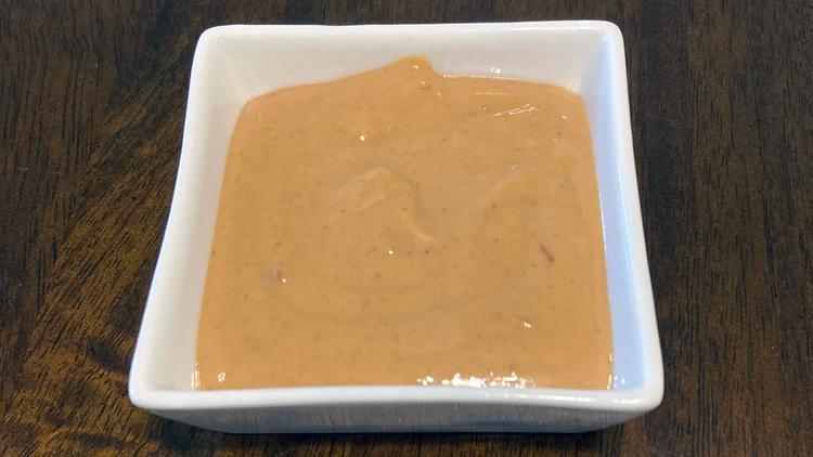 Photo of a small serving dish with peanut butter sauce