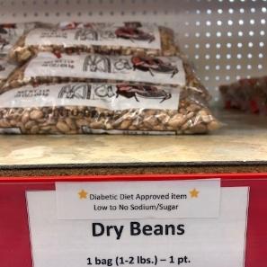 Photo of dry beans on a shelf at a food pantry