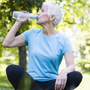 Photo of woman drinking water