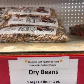 Photo of dry beans on a shelf at a food pantry