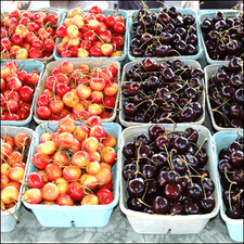 Photo of several baskets of cherries